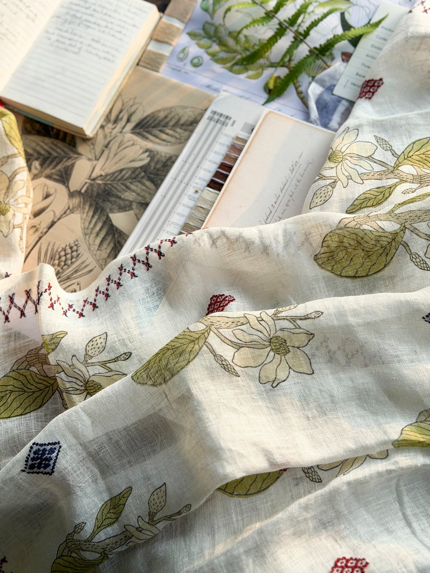 Close-up of red and navy Toda embroidery border on Magnolia Stole 1, Nilgiri Flora