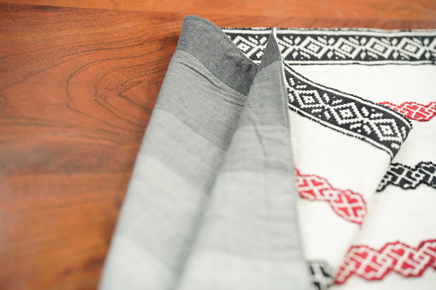 Meadow Runner styled on a table setting showing full length Toda embroidery
