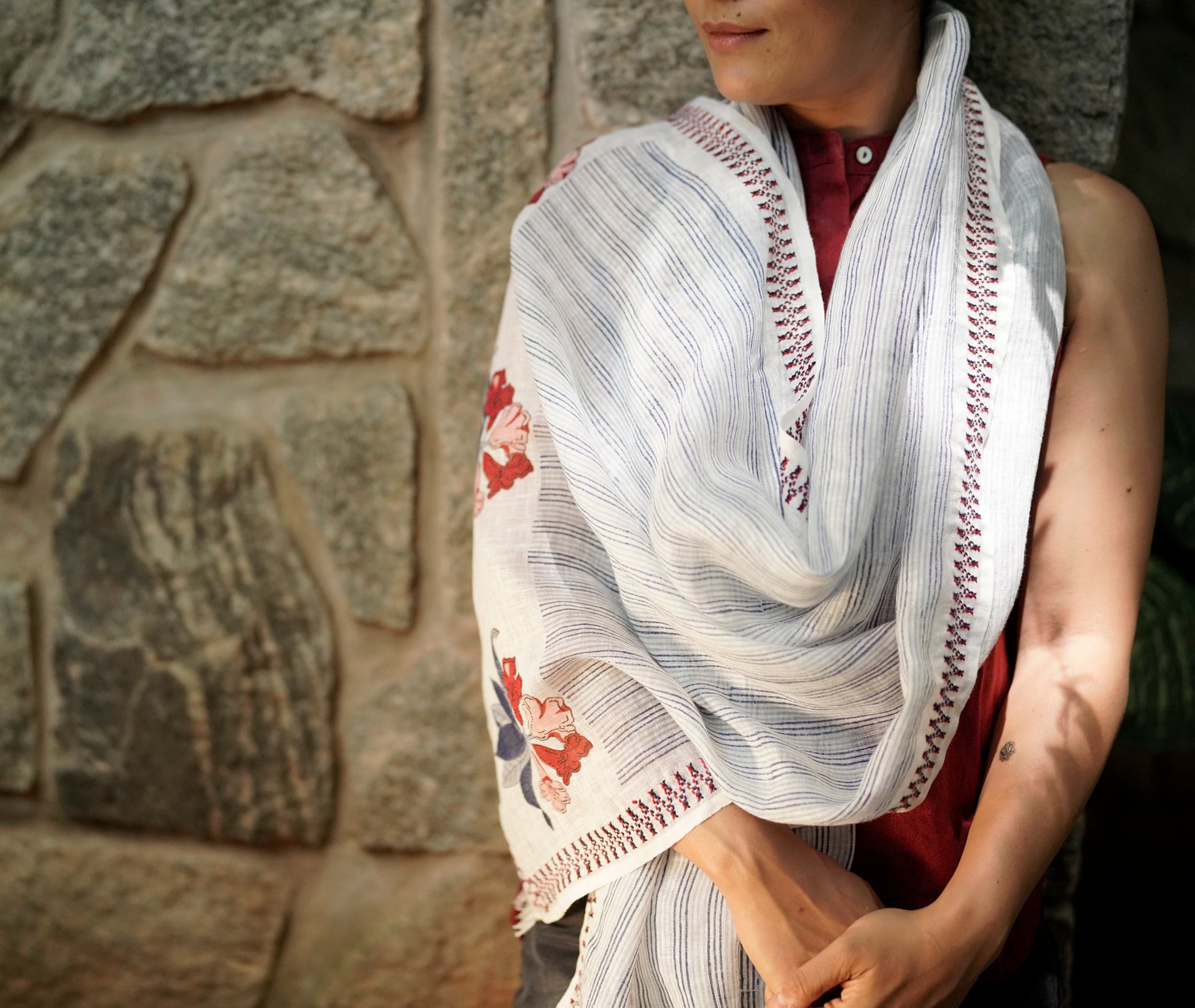 Detail of block-printed stripe and rhododendron motif with Toda embroidery border in red