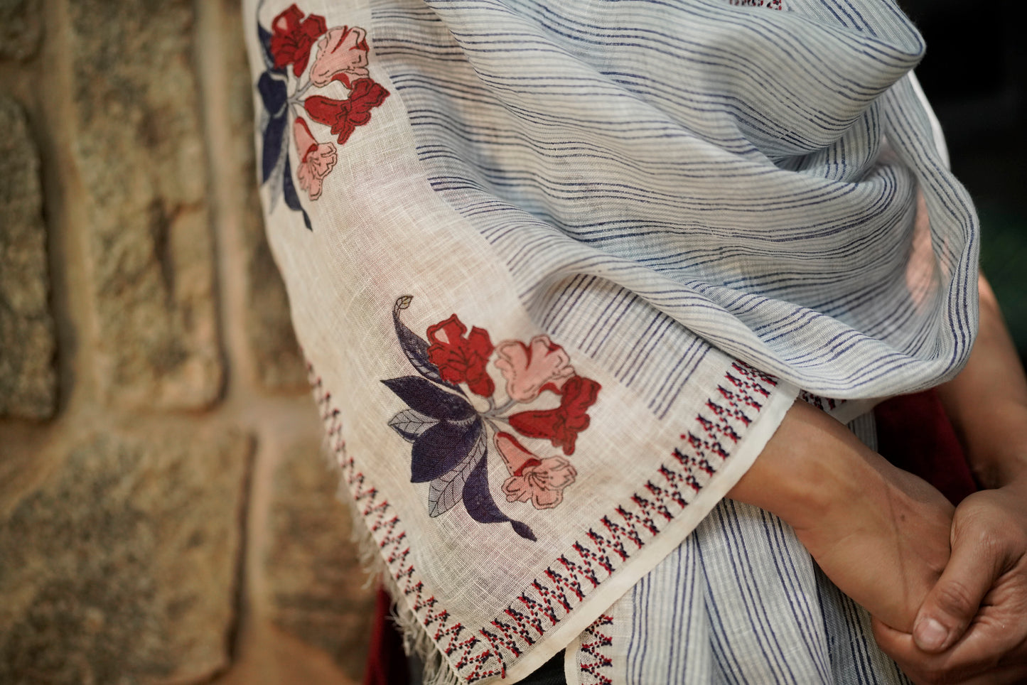 Close-up of red Toda pukhoor embroidery edge on Rhododendron Stole 2, Nilgiri Flora