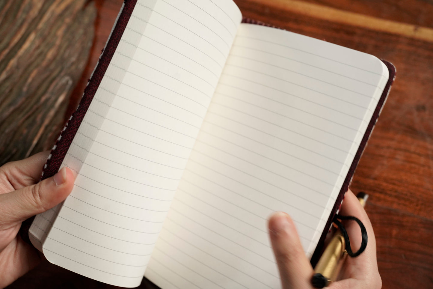 Red journal sleeve open showing A5 notebook pairing, luxury artisan gifting