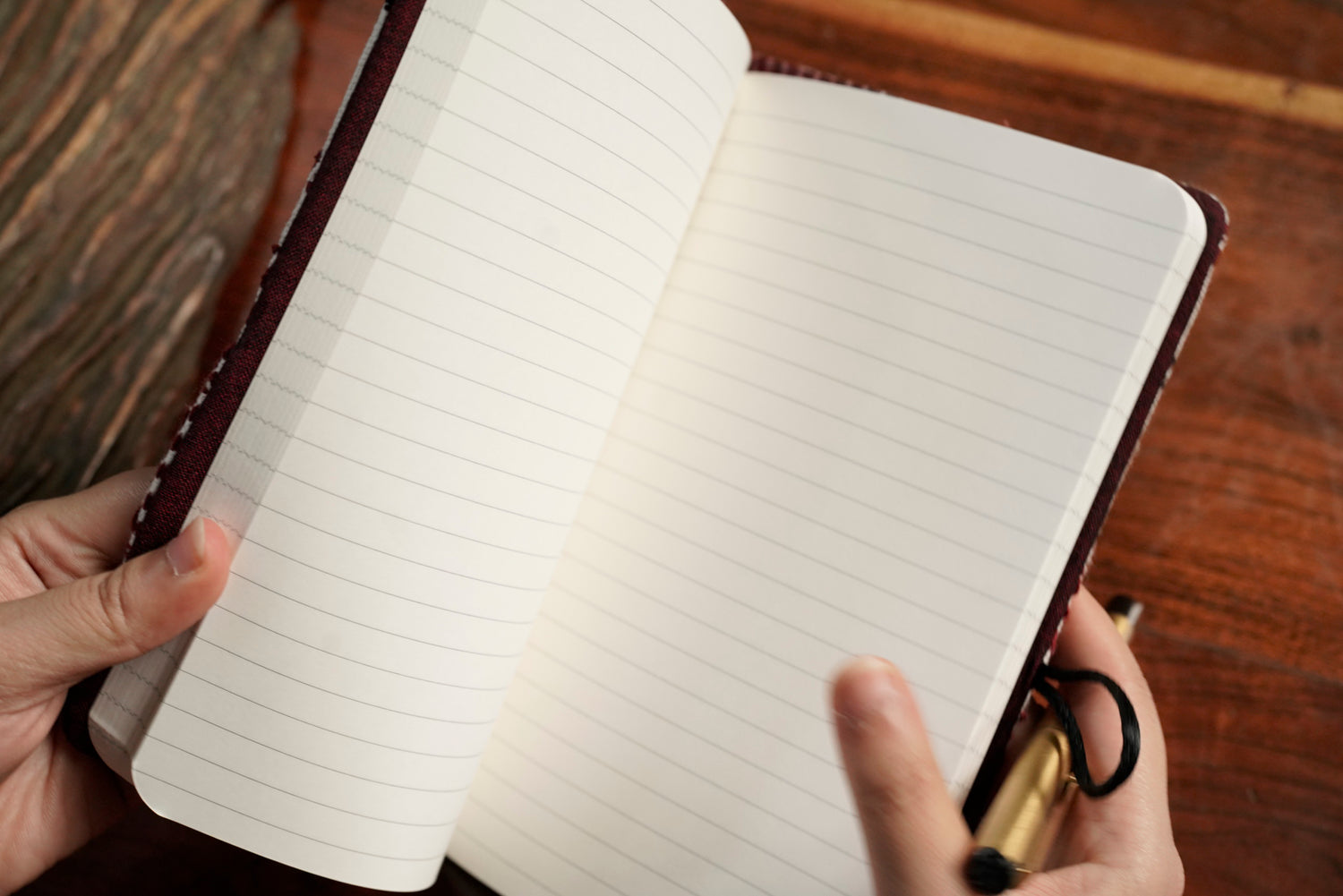 Red journal sleeve open showing A5 notebook pairing, luxury artisan gifting