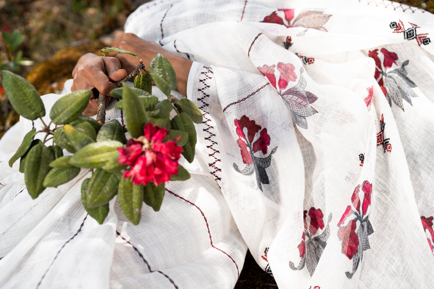 Close-up of Toda embroidery border on Rhododendron linen saree, Nilgiri Flora collection