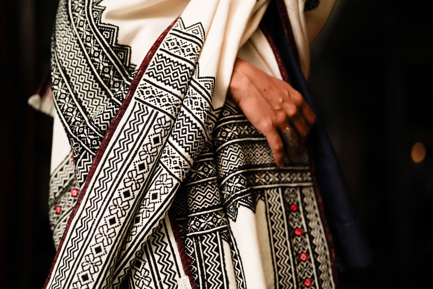 Full drape of Windsong shawl showing reversible embroidery on organic cotton