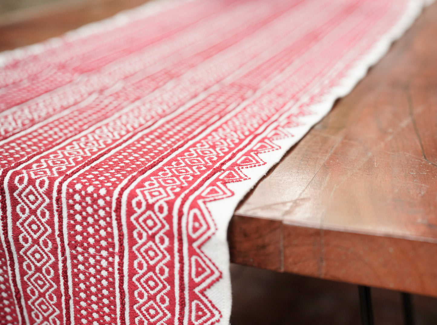 Detail of rich red Toda pukhoor embroidery on Classic Tapestry Rich Red panel, Nilgiris artisan