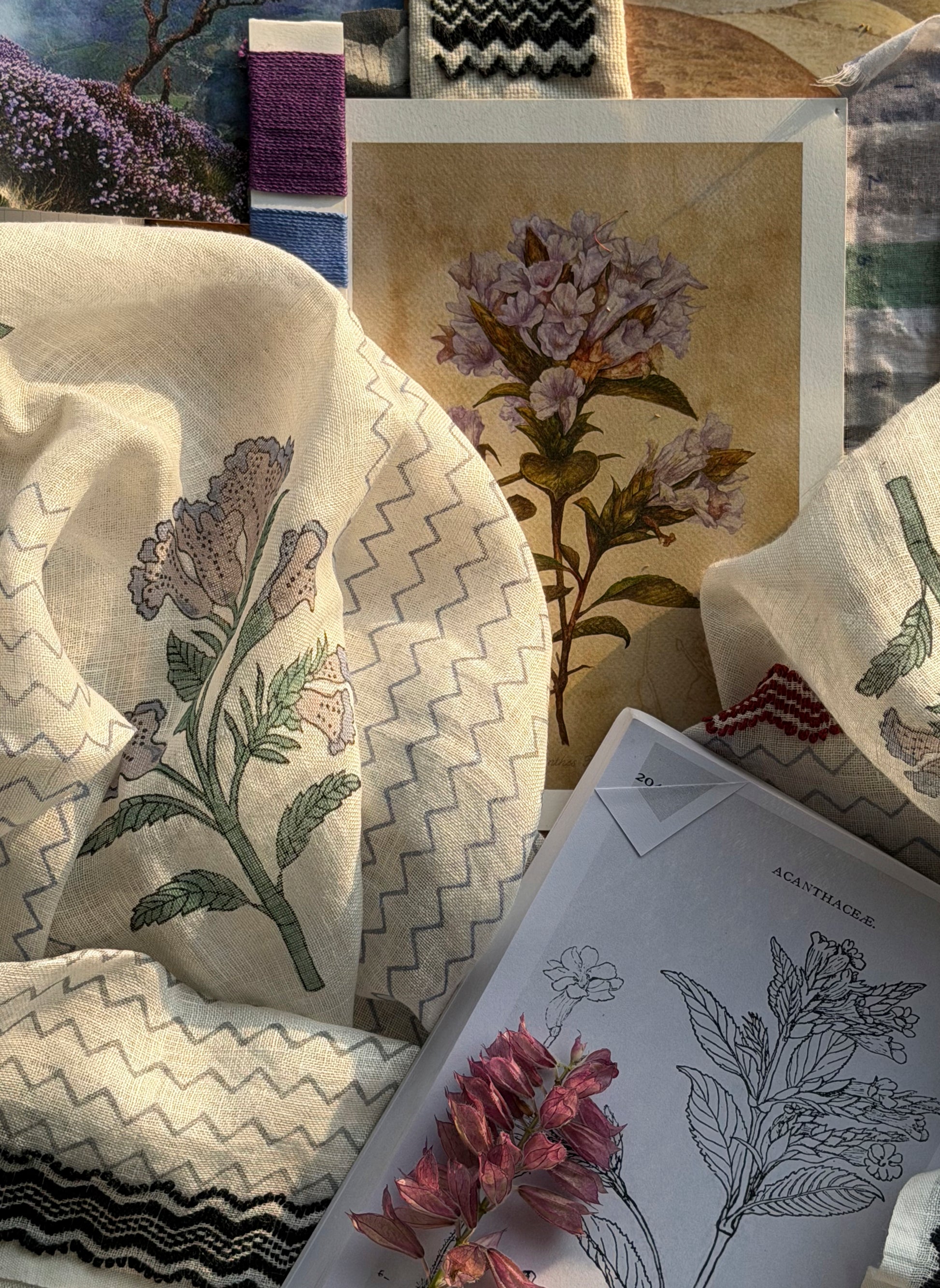 Full drape of Kurinji Stole 2 showing kurinji flowers across the cloth with Toda embroidery edges