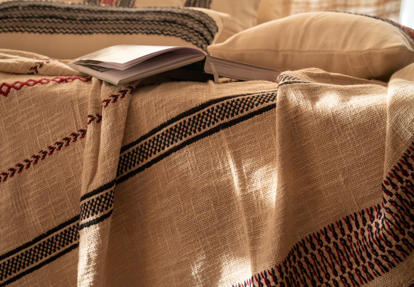 Detail of Toda pukhoor embroidery in wool yarn on Stillness cotton throw, counted stitch by stitch