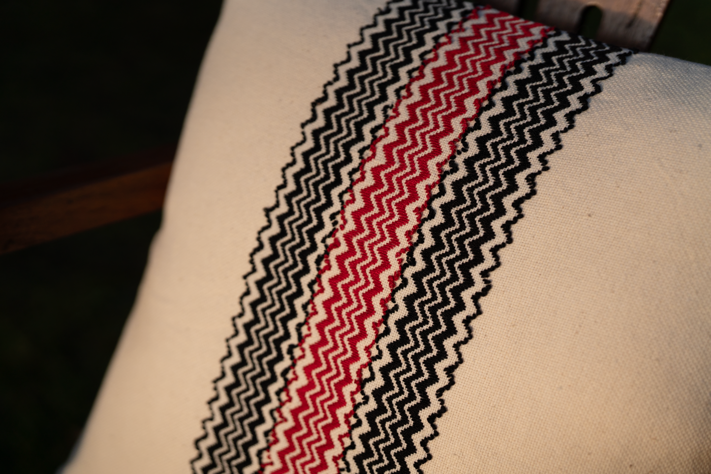 Detail of Twerr mountain Toda pukhoor embroidery in classic black and red on cushion cover
