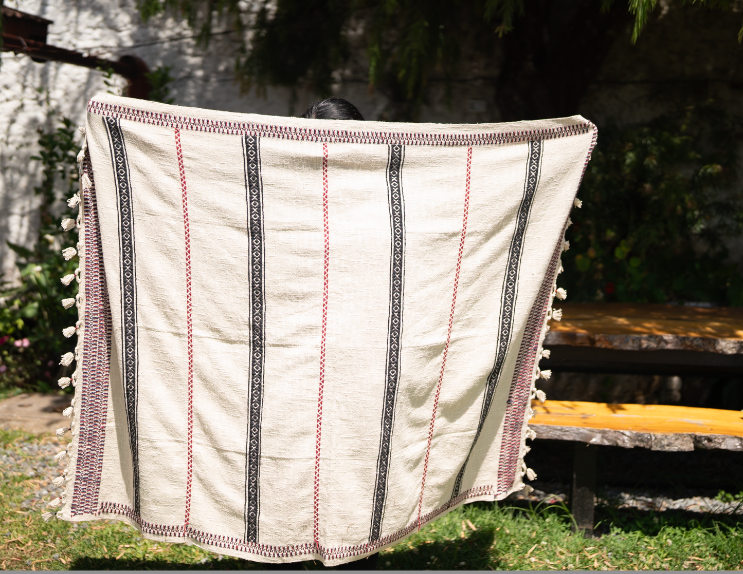 Pukhoor Throw draped on luxury interior setting showing texture and weight of slub cotton