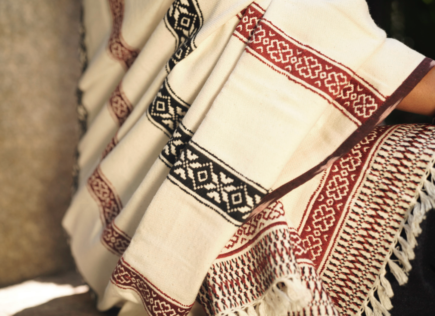 Full drape of Pukhoor shawl showing reversible embroidery and landscape motif borders