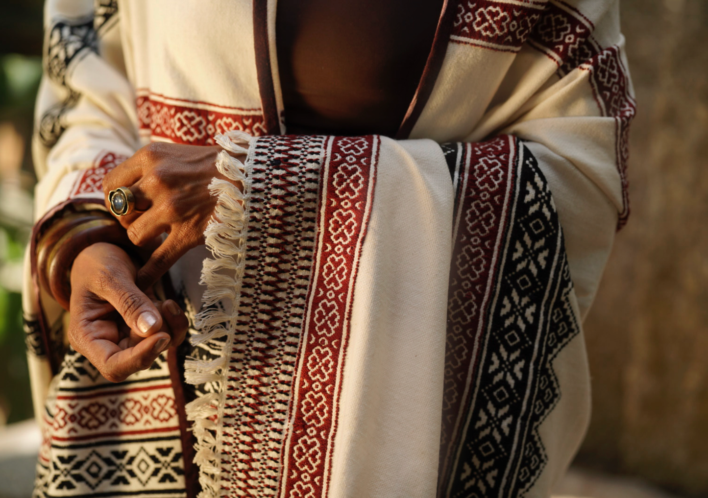 Close-up of Toda pukhoor embroidery in black and red on Pukhoor organic cotton shawl