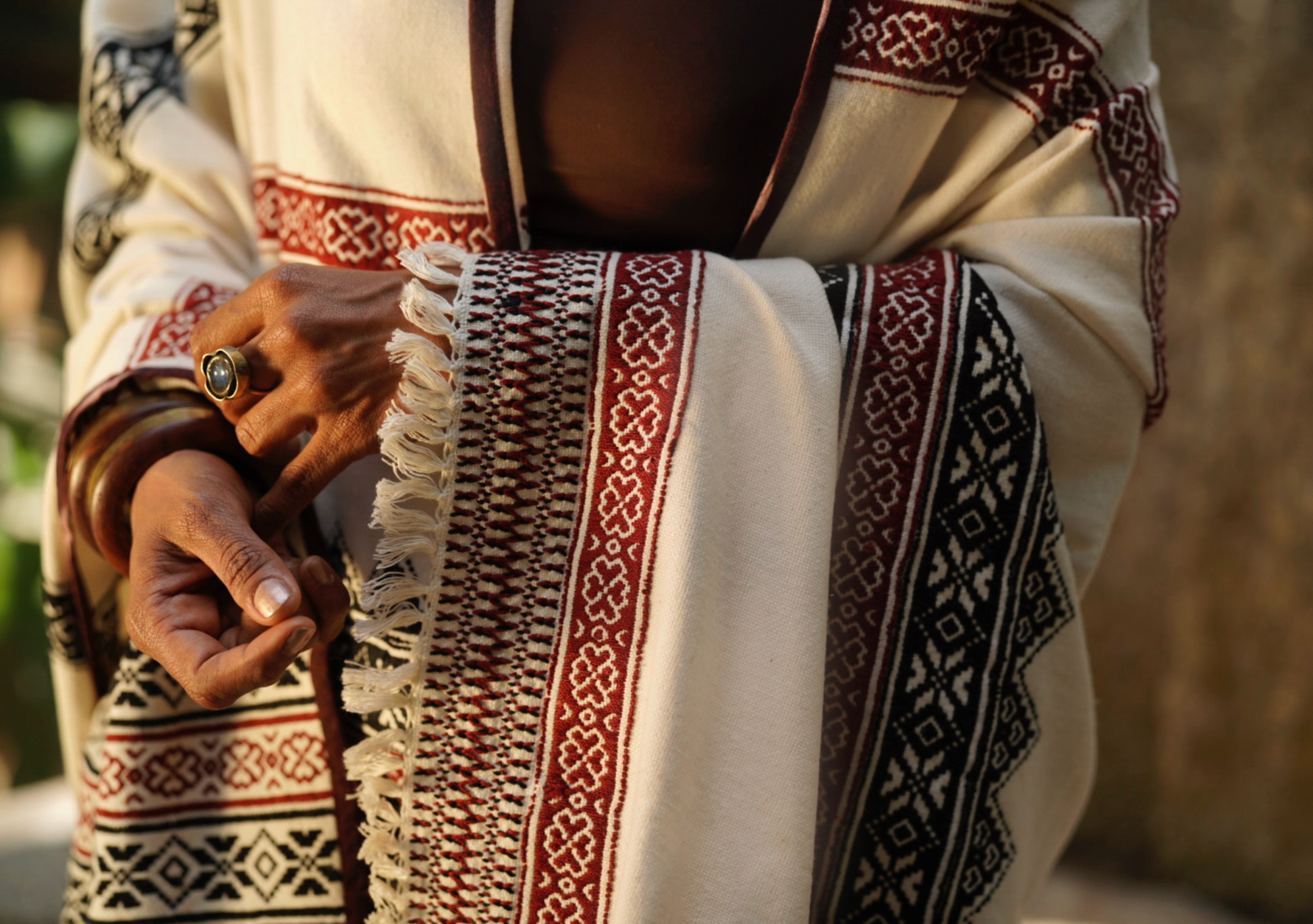 Close-up of Toda pukhoor embroidery in black and red on Pukhoor organic cotton shawl