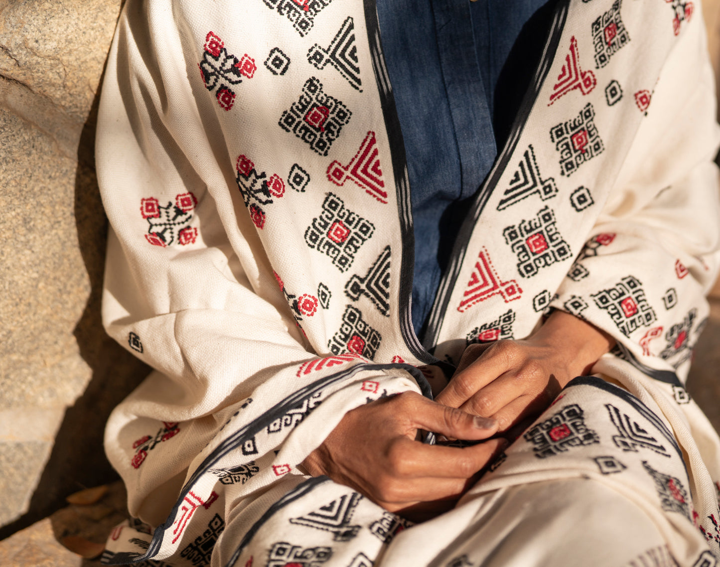Detail of black and red Toda pukhoor botanical embroidery on Flora cotton shawl
