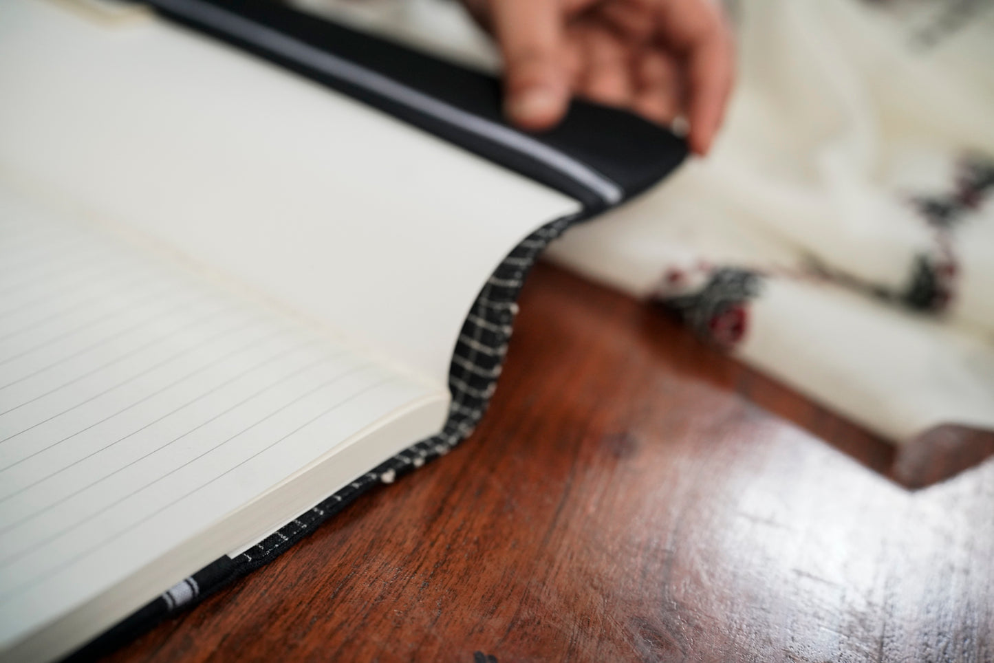 Detail of Toda pukhoor spine embroidery on The Classic Journal sleeve, Nilgiris artisan