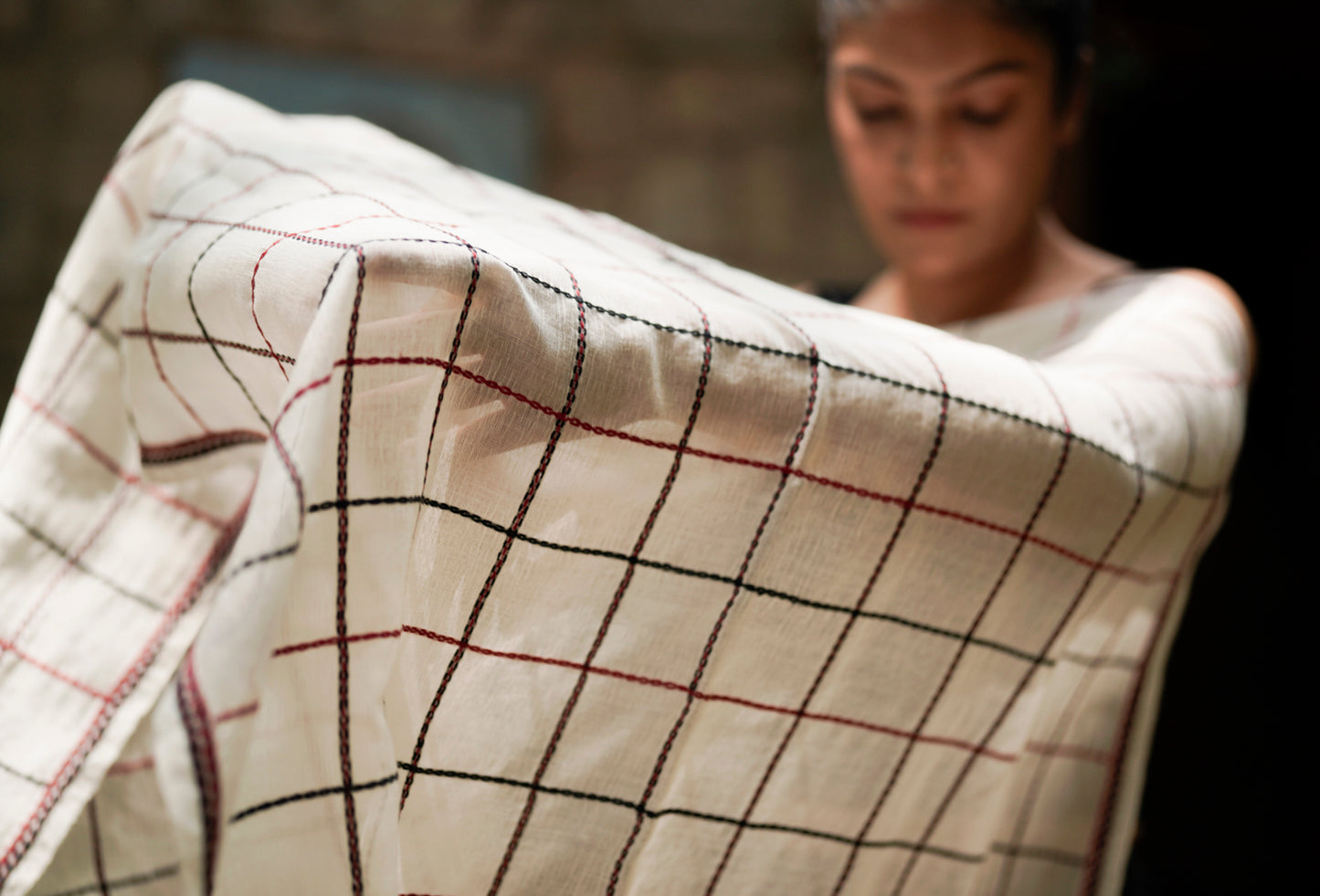 Detail of linear geometric grid pukhoor embroidery on The Grid stole, Nilgiris Toda artisan