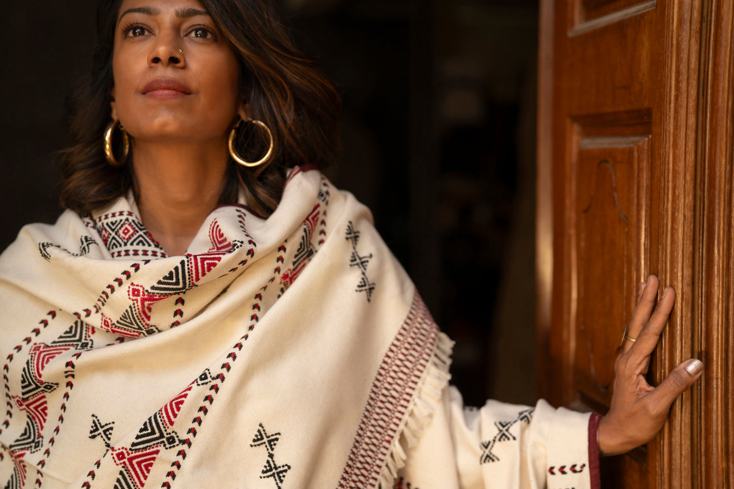 Detail of Toda pukhoor chevron embroidery in black and red on organic cotton shawl