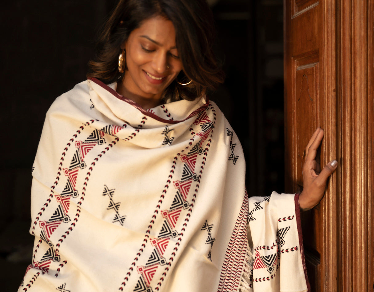 Draped view of Chevron shawl showing reversible embroidery and full chevron border
