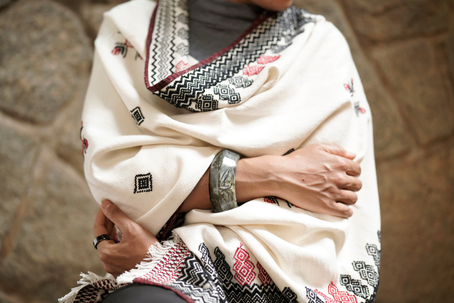 Full drape of Sacred Grove shawl showing reversible embroidery and botanical motif pattern