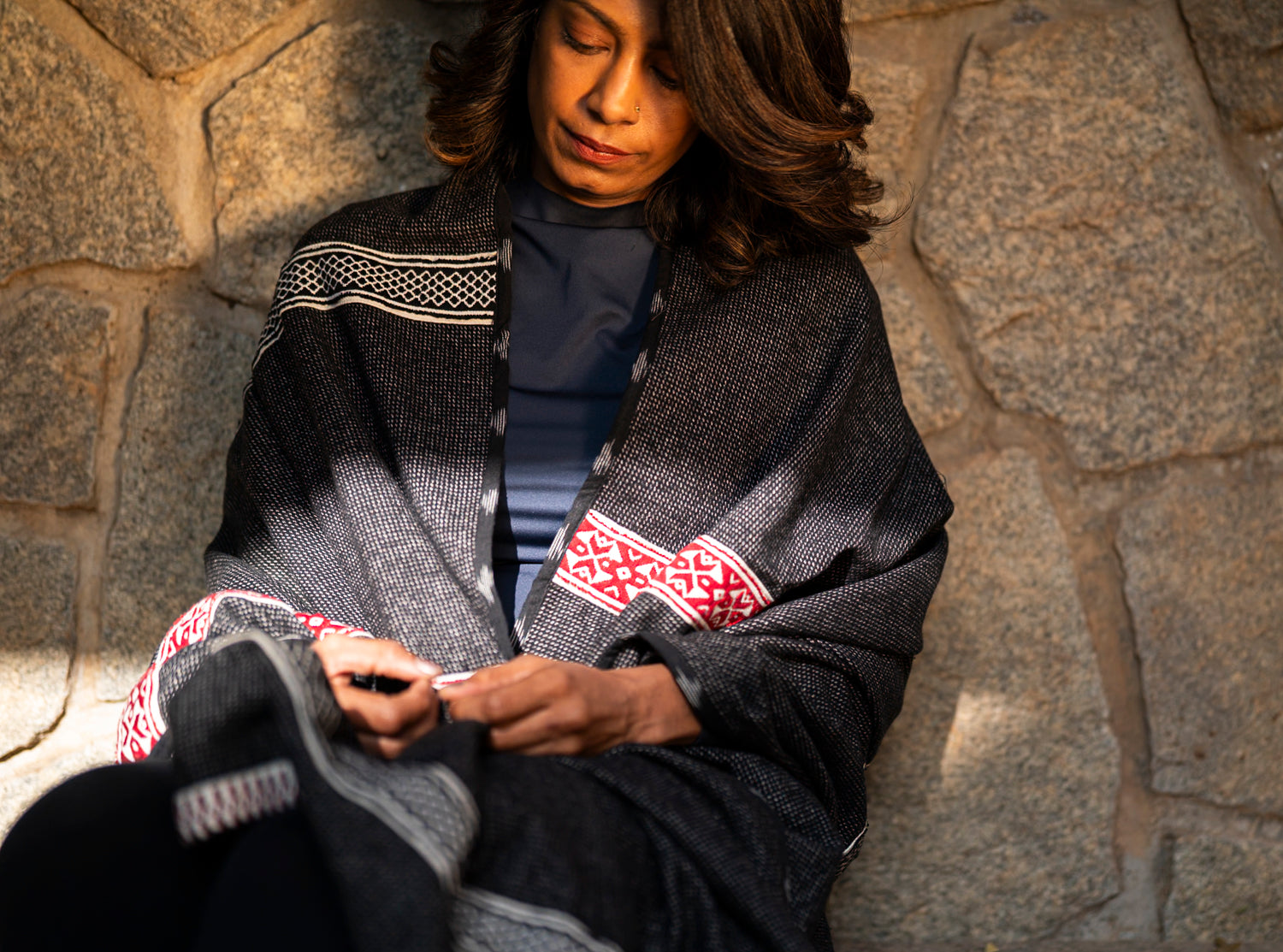Detail of Toda pukhoor geometric embroidery on cotton-wool winter shawl, mountain and forest motifs