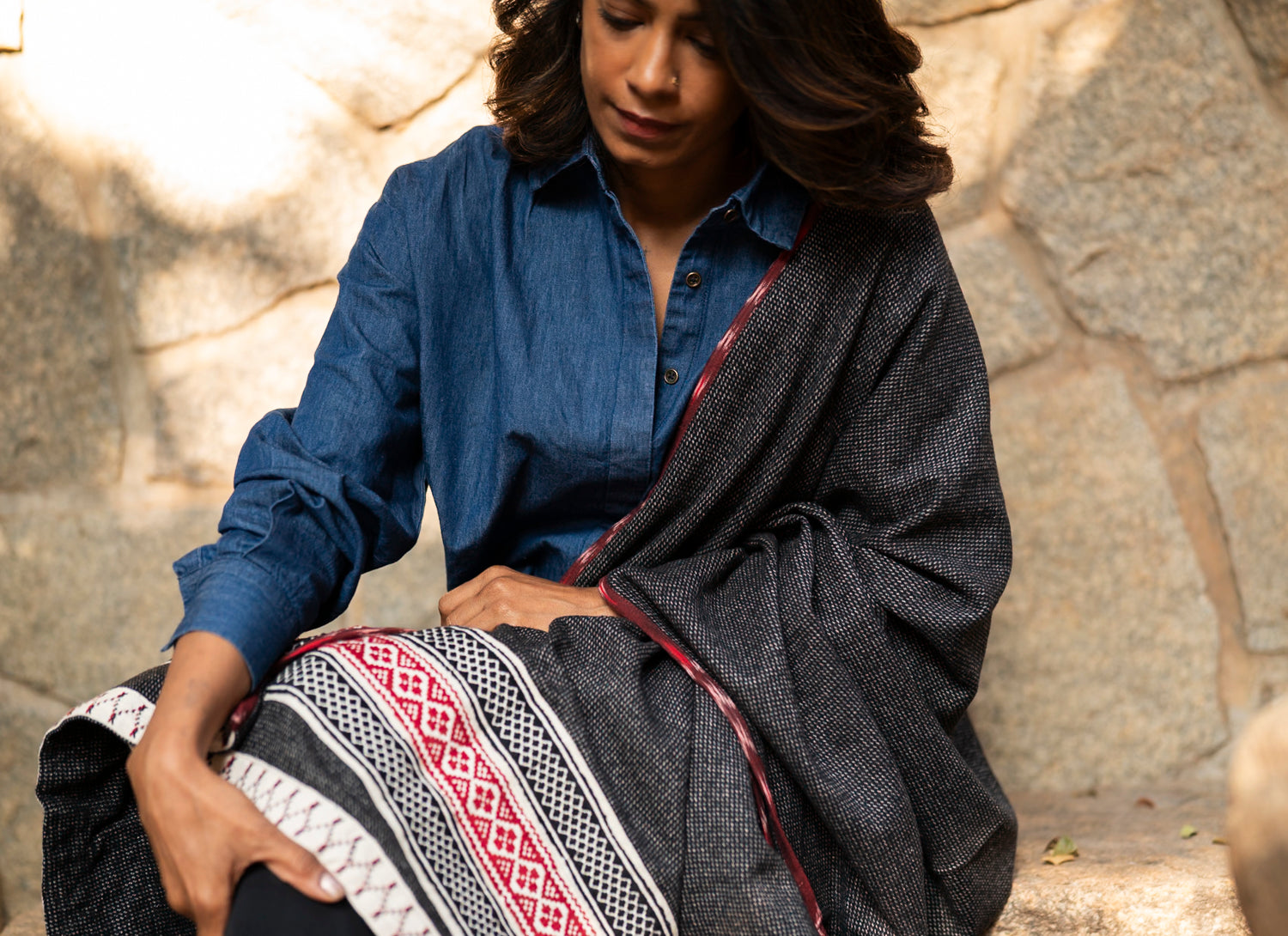 Close-up of honeycomb Toda pukhoor embroidery in black and red on cotton-wool blend winter shawl